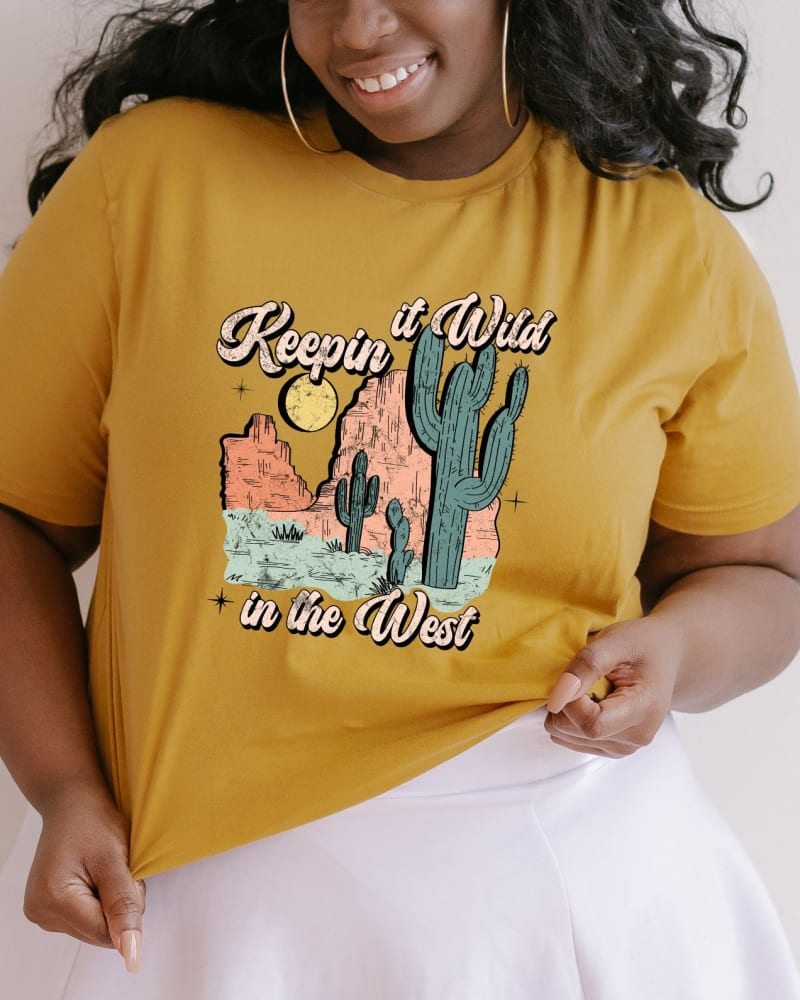 Front of a model wearing a size XL Keepin It Wild Colorful in Mustard by Simply Sage Market. | dia_product_style_image_id:281539
